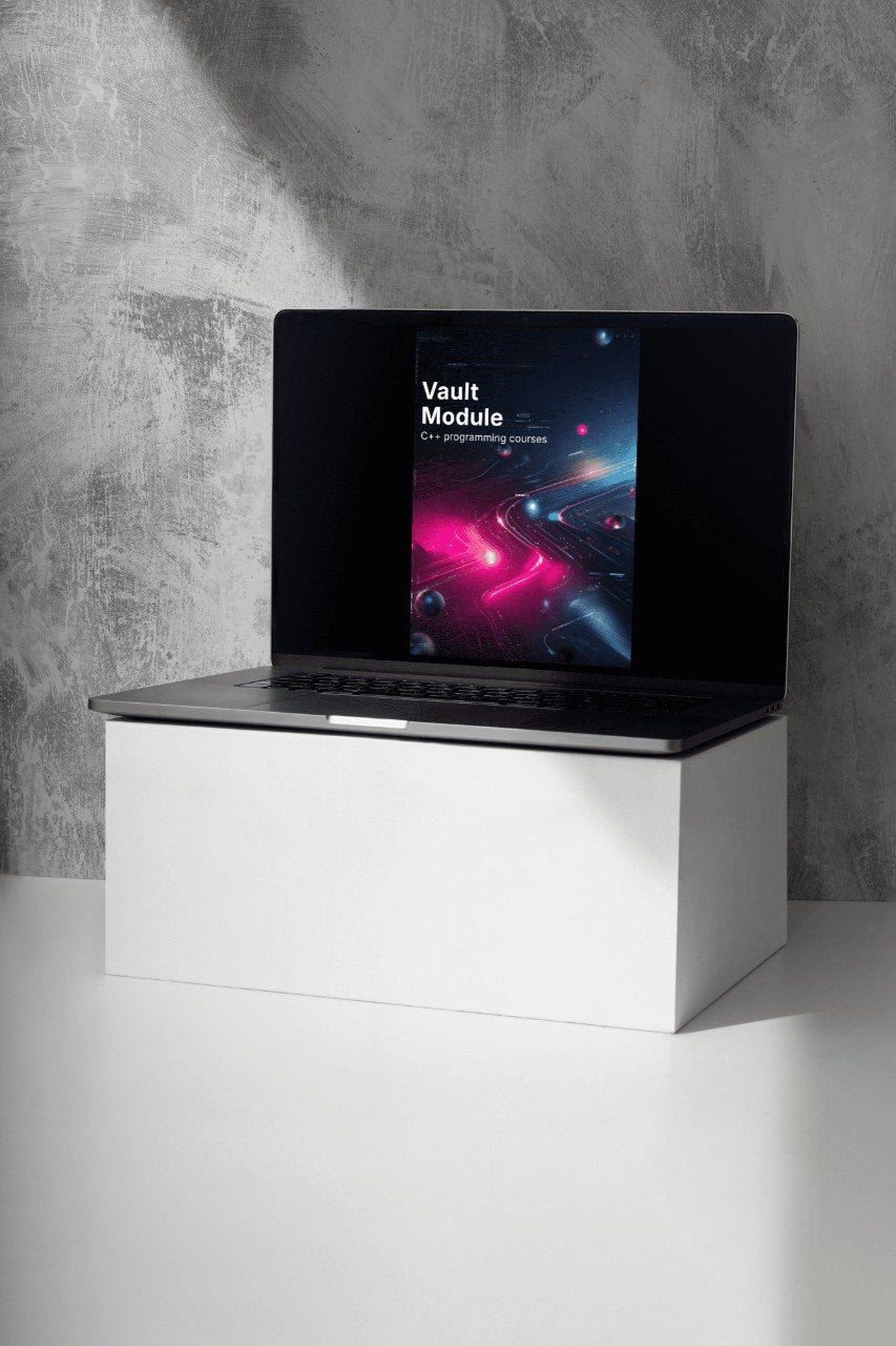 Laptop on a white stand against a gray concrete wall