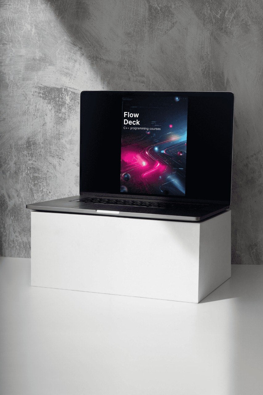 Laptop on a white stand with a concrete wall background